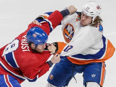 Montreal Canadiens right wing Brandon Prust exchanges punches with New York Islanders left wing Matt Martin during the first period at the Bell Centre on Saturday, Jan. 17.