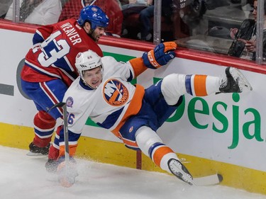 New York Islanders left wing Nikolay Kulemin falls after colliding with Montreal Canadiens defenseman Mike Weaver during the first period at the Bell Centre on Saturday, Jan. 17, 2015.
