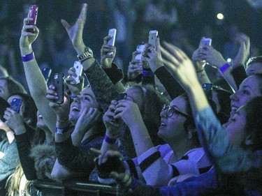 Fans take pictures of British singer Sam Smith during his concert at the Bell Centre in Montreal Monday January 19, 2015.