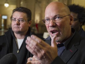 Marc Ranger, president of the Coalition syndicale pour la libre négotiation, right, with the  president of Montreal's blue-collar workers union, Michel Parent, speaks to reporters following  special Montreal council meeting on Monday, Jan. 19, 2015.