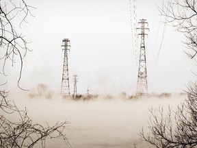 Steam rises from Lac St. Louis in front of Hydro towers in LaSalle in January 2014.