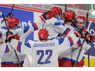Team Russia players celebrate after beating Team USA in their 2015 IIHF World Junior Championship quarterfinal hockey match at the Bell Centre in Montreal on Friday, January 2, 2015.
