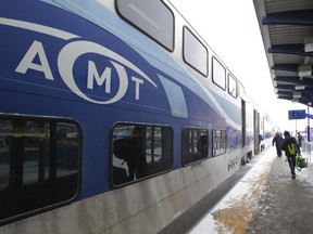 Passengers prepare to board an AMT train at the Vaudreuil train station in Vaudreuil-Dorion, west of Montreal.