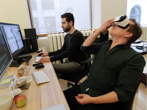 Félix Lajeunesse, right, and Paul Raphaël work on one of their virtual-reality projects at their studio in Old Montreal on Tuesday, Jan. 20, 2015.