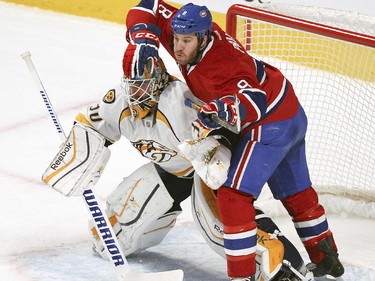 Montreal Canadiens Brandon Prust tries to avoid contact with Nashville Predators  goalie Carter Hutton during second period of National Hockey League game in Montreal Tuesday January 20, 2015.
