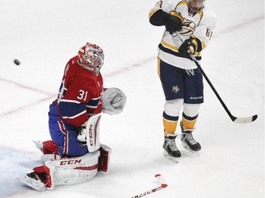 Montreal Canadiens goalie Carey Price has no stick as a shot deflected by Predator Mike Ribeiro goes in for the first goal of the game during second period of National Hockey League game in Montreal Tuesday January 20, 2015.