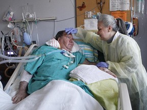 Luciana D'Amore, right, looks after her husband, Gian Libero Casale, at the Montreal Chest Institute. The first move from the MUHC in anticipation of the opening of the superhospital in the Glen Campus starts this weekend the heaviest of patients — those on ventilators — in long term care. They're being transferred to a pavilion in Lachine, most against their will.