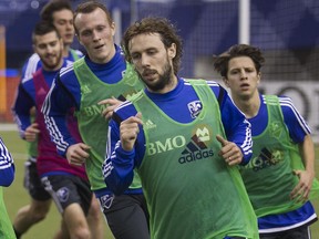 Marco Donadel runs with other members of the Impact during the first practice of MLS training camp at Olympic Stadium on Jan. 23, 2015.