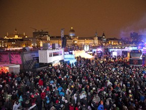 Crowd dances at the Jacques Cartier Pier as  DJ Stehpan Bodzin spins during the second of four weekends of Igloofest, at the Old Port in Montreal, Friday January 24, 2014.