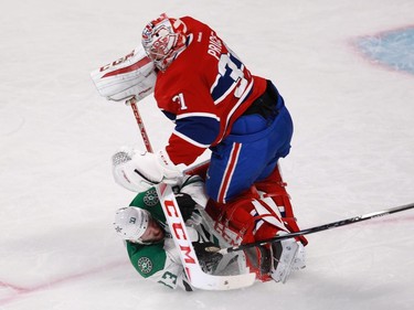 Alex Goligoski of the Dallas Stars collides with Carey Price of the Montreal Canadiens  in the third period of an NHL game at the Bell Centre in Montreal Tuesday, January 27, 2015. Goligoski received a tripping penalty.