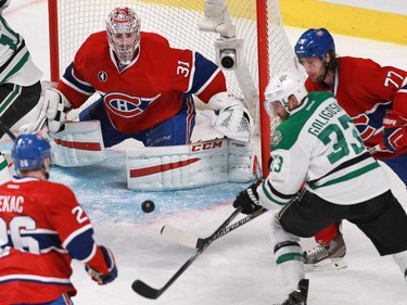 Alex Goligoski of the Dallas Stars tries to get a shot on Carey Price of the Montreal Canadiens in the third period of an NHL game at the Bell Centre in Montreal Tuesday, January 27, 2015. Canadiens defenders are Jiri Sekac (left) and Tom Gilbert.