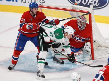 Alexei Emelin of the Montreal Canadiens tries to clear Travis Moen of the Dallas Stars away from Carey Price in the first period of an NHL game at the Bell Centre in Montreal Tuesday, January 27, 2015.