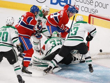 Brendan Gallagher of the Montreal Canadiens (#11) scores against Kari Lehtonen of the Dallas Stars in the second period of an NHL game at the Bell Centre in Montreal Tuesday, January 27, 2015, as teammate Alex Galchenyuk watches. Dallas player defending, from the left are: Cody Eakin, Trevor Daley and Alex Goligoski.