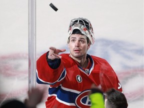 Canadiens goalie Carey Price tosses a puck to fans after being named the first star at the Bell Centre following a 3-2 win over the Dallas Stars on Jan. 27, 2015.
