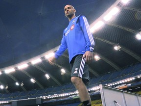 Newly acquired Impact player Laurent Ciman of Belgium walks on the field at Montreal's Olympic Stadium for the first time on Jan. 27, 2015.
