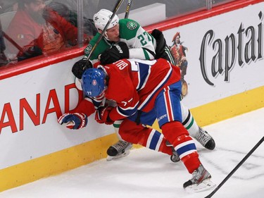 Tom Gilbert of the Montreal Canadiens and Travis Moen of the Dallas Stars battle in the second period of an NHL game at the Bell Centre in Montreal Tuesday, January 27, 2015.