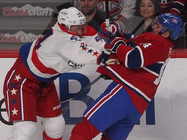 Washington Capitals' Brooks Orpik, left, hits Montreal Canadiens' Tomas Plekanec, during first period NHL action in Montreal on Saturday, January 31, 2015.