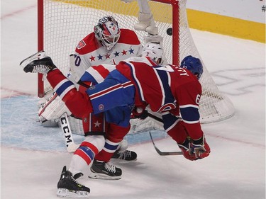 Washington Capitals' Matt Niskanen, centre, watches Montreal Canadiens' Max Pacioretty, right, score game winning on Washington Capitals goalie Braden Holtby during overtime period NHL action in Montreal on Saturday, January 31, 2015.