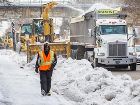 A snow-clearing operation on Berri St. in Montreal Jan. 5, 2015.