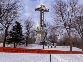 Greenpeace activists angry with Montreal-based Resolute Forest Products draped a protest banner over the cross on Mount Royal in the early-morning hours of March 18, 2014.