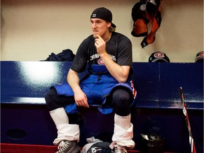 Canadiens forward Dale Weise takes off his equipment in locker room after practice at the Bell Sports Complex in Brossard on Nov. 27, 2014.