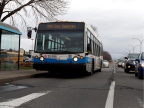 STM bus 209 heads north on des Sources Blvd. in Montreal on Friday November 7, 2014.