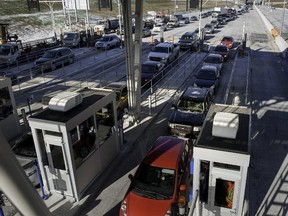 Traffic started to flow through the newly opened Highway 30 toll booth in Les Cedres on Dec. 15, 2012.