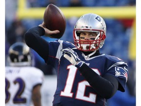 New England Patriots quarterback Tom Brady warms up before playoff game against the Baltimore Ravens on Jan. 10, 2015, in Foxborough, Mass.