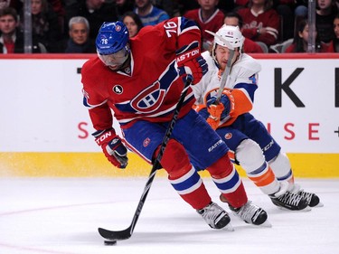 P.K. Subban of the Montreal Canadiens skates with the puck while being chased by Michael Grabner of the New York Islanders at the Bell Centre on Saturday, Jan. 17.