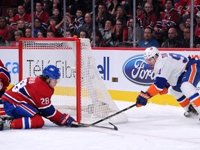 Nathan Beaulieu gets down to stop the wraparound attempt by John Tavares of the New York Islanders Saturday, Jan. 17, at the Bell Centre.