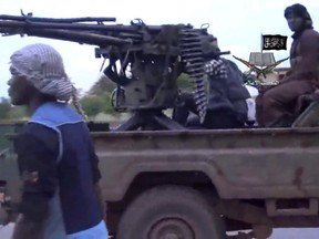 A screengrab taken on August 24, 2014 from a video released by the Nigerian Islamist extremist group Boko Haram and obtained by AFP shows alleged members of the Nigerian Islamist extremist group Boko Haram at an undisclosed location.