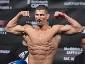 Nordine Taleb from Montreal flexes at the UFC Fight Nights weigh-in in Halifax on Oct. 3, 2014.