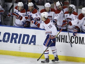 The Canadiens' P.A. Parenteau is congratulated by his teammates after scoring the winning goal in shootout against the Florida Panthers on Dec. 30, 2014, in Sunrise, Fla.