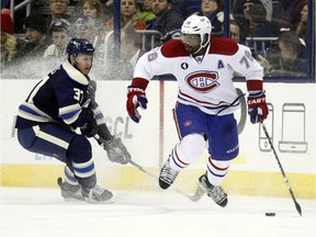 Montreal Canadiens' P.K. Subban, right, works for the puck against Columbus Blue Jackets' Sean Collins during the second period of an NHL hockey game in Columbus, Ohio, Wednesday, Jan. 14, 2015.