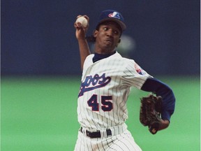 The Expos' Pedro Martinez fires a pitch against the Cincinnati Reds on April 13, 1994 at Montreal's Olympic Stadium.