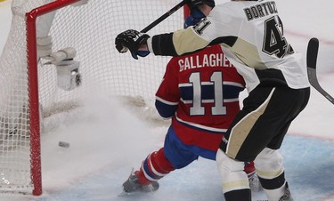 Canadiens' Brendan Gallagher watches the goal of Max Pacioretty, not seen, go into net while Pittsburgh Penguins' Robert Bortuzzo, skates in for interference, during first period NHL action in Montreal on Saturday January 10, 2015. (Pierre Obendrauf / MONTREAL GAZETTE)
