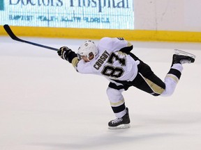 Pittsburgh Penguins star Sidney Crosby follows through on slapshot during game against the Panthers on Dec. 22, 2014 in Florida.