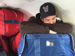 Canadiens goalie Carey Price slumps into his seat on a small jet, surrounded by his equipment, his carry-on bag on his lap, Monday afternoon in Columbus.