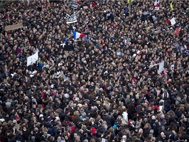 Protestors gather at Republique Square in Paris, Sunday, Jan. 11, 2015.  Thousands of people began filling France's iconic Republique plaza, and world leaders converged on Paris in a rally of defiance and sorrow on Sunday to honor the 17 victims of three days of bloodshed that left France on alert for more violence.