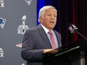 New England Patriots owner Robert Kraft reads a statement during a Super Bowl news conference on Jan. 26, 2015, in Chandler, Ariz.
