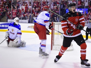 Team Canada's Sam Reinhart celebrates his goal past Team Russia goaltender Ilya Sorokin as Russia's Vladislav Gavrikov skates by during second period gold medal game hockey action at the IIHF World Junior Championship in Toronto on Monday, Jan. 5, 2015.