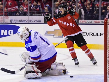 Team Canada's Sam Reinhart celebrates a goal by teammate Max Domi past Team Russia goaltender Ilya Sorokin during first period gold medal game hockey action at the IIHF World Junior Championship in Toronto on Monday, Jan. 5, 2015.
