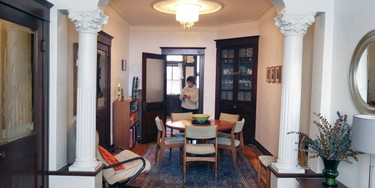 An arch with Corinthian columns seperates the living room from the dining room in Teresa Lunsford's apartment.