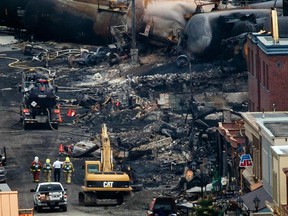 Emergency crew workers on Frontenac street work in the rubble at the scene of the train explosion in the town of Lac-Mégantic, 100 kilometres east of Sherbrooke on Wednesday, July 10, 2013.