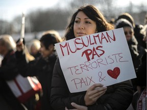 As implied by this placard held at a rally in Geneva on Thursday, "the Muslim population is the object of the highest level of stigma of any faith group right now," says intercultural-relations expert Jack Jedwab.