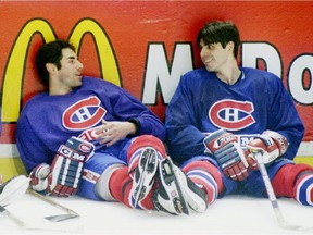 In this Jan. 14, 1995 file photo, Canadiens' Mathieu Schneider and J.J. Daigneault (right) take a break in practice after NHL lockout ended.