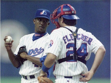 Montreal Expos Pedro Martinez chats with catcher Darrin Fletcher during May 13. 1997 game.