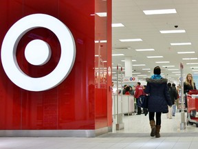 Shoppers enter a Target store in Toronto on Thursday, Jan. 15, 2015. Target says it will close its stores in Canada - a market that it entered only two years ago. The U.S. based retail company has 133 Canadian locations and 17,600 employees across the country.