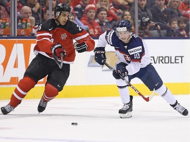 TORONTO, ON - JANUARY 4:  Darnell Nurse #25 of Team Canada skates to check Martin Reway #10 of Team Slovakia during a semi-final game in the 2015 IIHF World Junior Hockey Championship at the Air Canada Centre on January 4, 2015 in Toronto, Ontario, Canada.