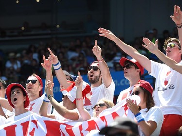 Spectators cheer for Canada's Eugenie Bouchard during her women's singles match against France's Caroline Garcia on day five of the 2015 Australian Open tennis tournament in Melbourne on January 23, 2015.